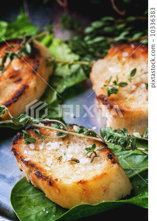 Fried bread croutons with thym 10336383