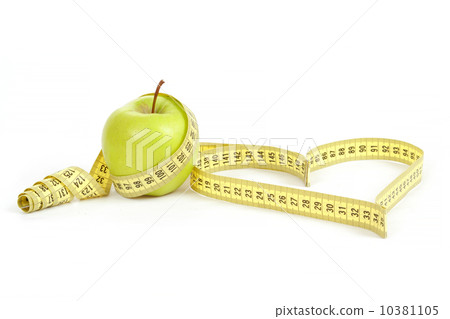 green apple with a measuring tape and heart symbol isolated 10381105