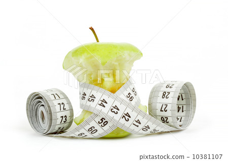 Green bitten apple isolated on white with measuring tape 10381107
