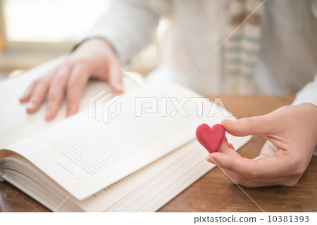 A woman reading a book (love story) A woman reading a book (love story) 10381393