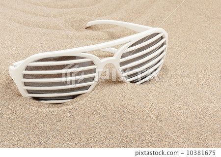 funny sun glasses in sand 10381675