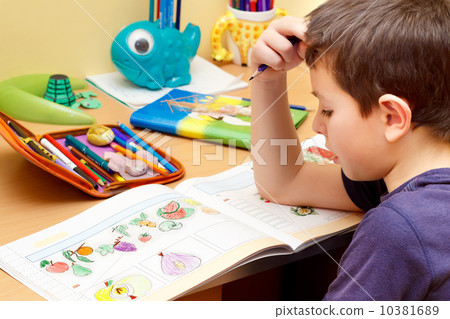 boy doing homework 10381689