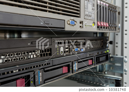 servers stack with hard drives in a datacenter 10381748