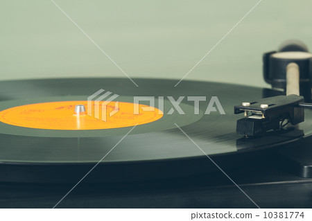 Spinning vinyl record. Motion blur image. Vintage toned. Spinning vinyl record. Motion blur image. Vintage toned. 10381774