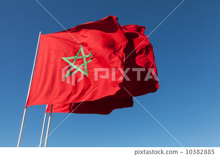 National flags of Morocco above clear blue sky National flags of Morocco above clear blue sky 10382885