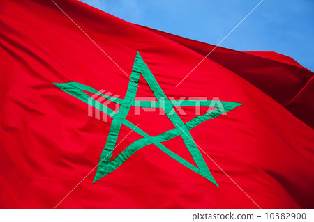 National flag of Morocco above clear blue sky 10382900