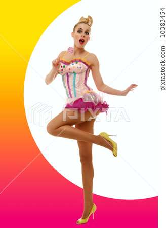 Girl dressed as a doll with lollipop. 10383454