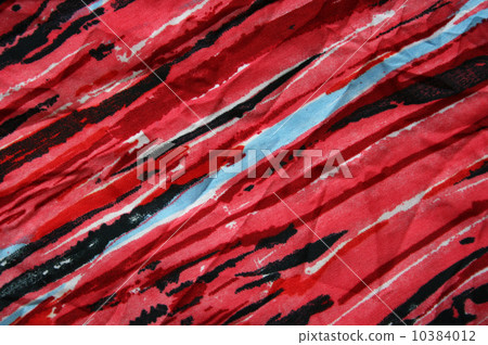 Blue, black and red strips on the fabric as background 10384012
