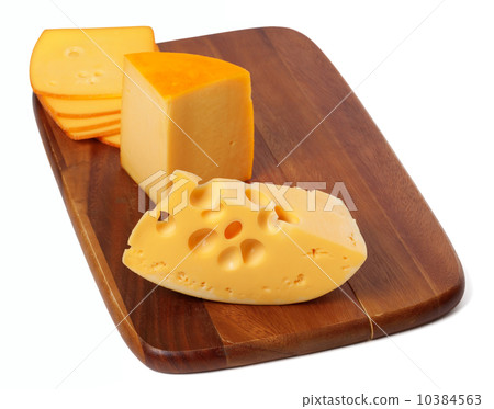 Cheeses on wooden kitchen board Cheeses on wooden kitchen board 10384563