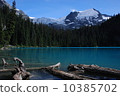 A mountain holding a glacial lake and a glacier 10385702