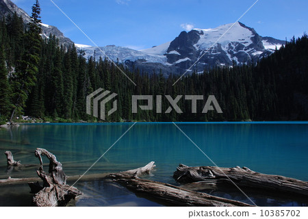 A mountain holding a glacial lake and a glacier 10385702