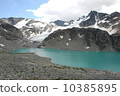 A mountain holding a glacial lake and a glacier 10385895