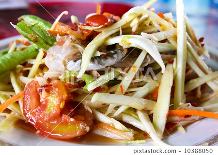 Thai papaya salad also known as Som Tum from Thailand. Thai papaya salad also known as Som Tum from Thailand. 10388050