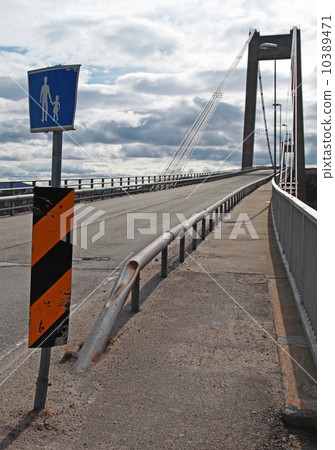 Warning pedestrian road sign on the cable-stayed bridge in Norwa 10389471