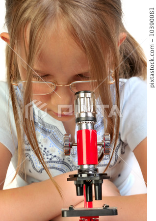 Girl studying something with microscope 10390081