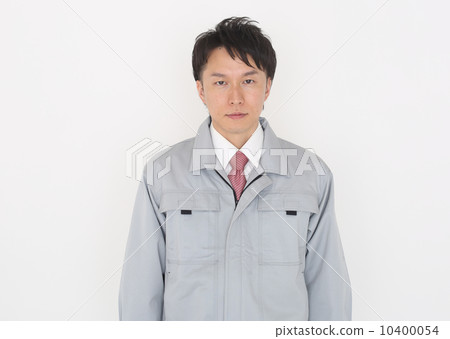 A young man wearing work clothes 10400054