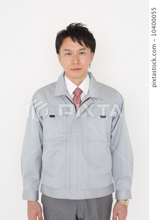 A young man wearing work clothes 10400055