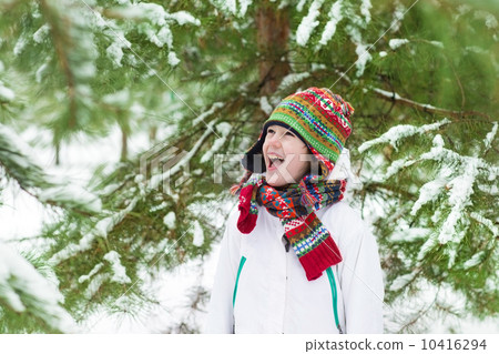 Funny little boy screaming of joy playing snow ball fight in a s 10416294