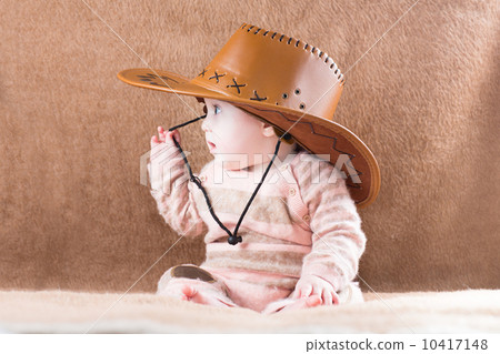 Sweet little baby girl in a cowgirl outfit 10417148