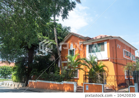Orange house with palm trees Orange house with palm trees 10420830
