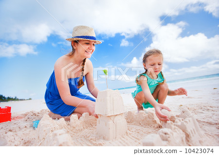 Mother and daughter playing at beach Mother and daughter playing at beach 10423074