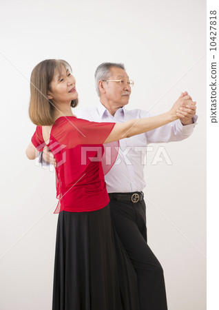 A couple in their 60s dancing ballroom dancing 10427818