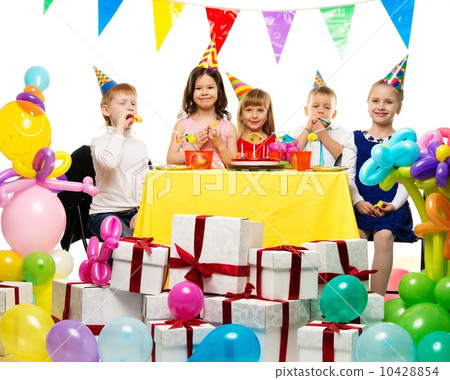 Croup of happy children celebrating birthday behind table Croup of happy children celebrating birthday behind table 10428854
