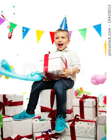 Little happy boy holding gift box 10429013