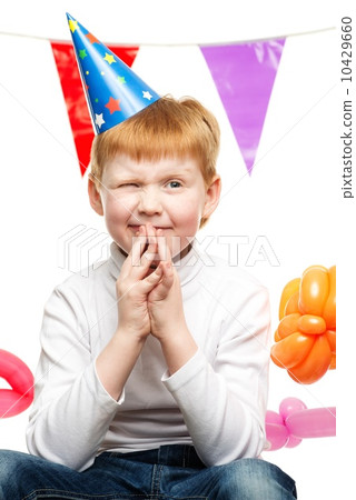 Little redhead boy in birthday paper hat Little redhead boy in birthday paper hat 10429660