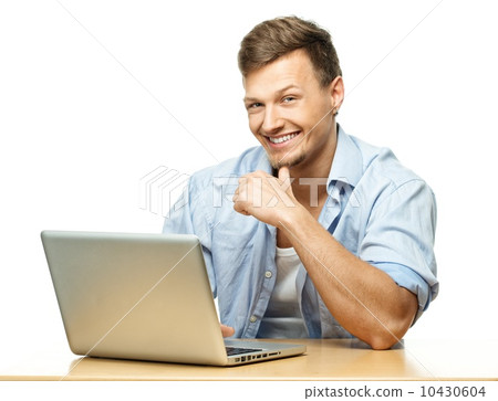 Smiling stylish young man behind laptop isolated on white Smiling stylish young man behind laptop isolated on white 10430604