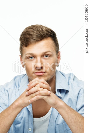 Stylish man in blue shirt with earring isolated on white Stylish man in blue shirt with earring isolated on white 10430609