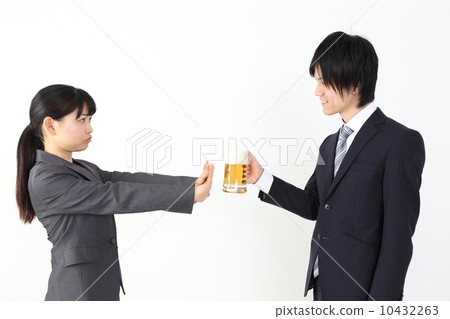 Female employee refusing beer 10432263