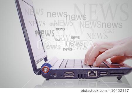 Image of hand on the laptop keyboard with the word news out of t 10432527
