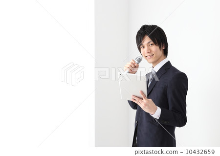 Businessman talking with a microphone 10432659