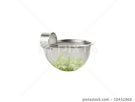Tea strainer loaded with green tea 10432868