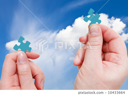 male and female hands with little puzzle pieces male and female hands with little puzzle pieces 10433664