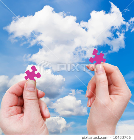 male and female hands with little puzzle pieces 10433706
