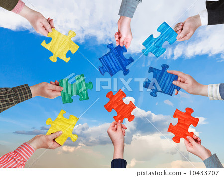 people hands with puzzle pieces with afternoon sky people hands with puzzle pieces with afternoon sky 10433707