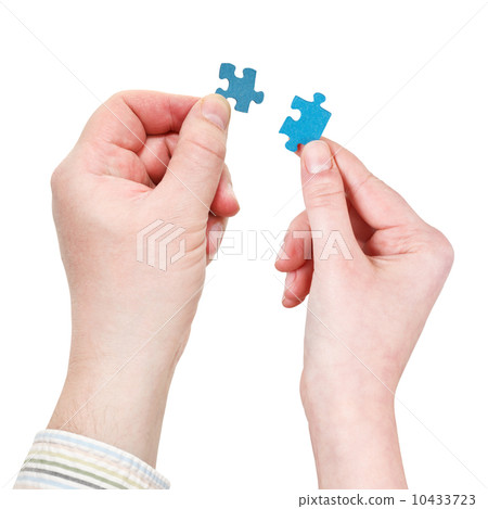 male and female hands with little puzzle pieces 10433723