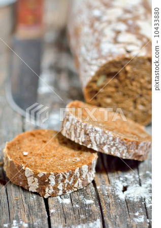 Brown bread on an old wooden table 10433880