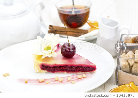piece of cherry pie on a table in a restaurant piece of cherry pie on a table in a restaurant 10433973