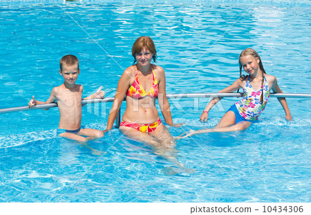 Family in the swimming pool. Family in the swimming pool. 10434306