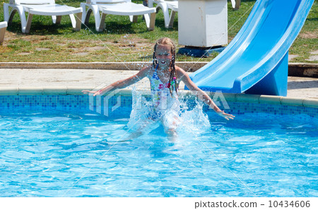 Girl in summer outdoor pool. 10434606