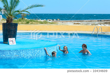 Family in the swimming pool. 10434609