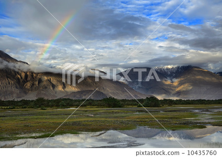 Rainbow over mountains 10435760