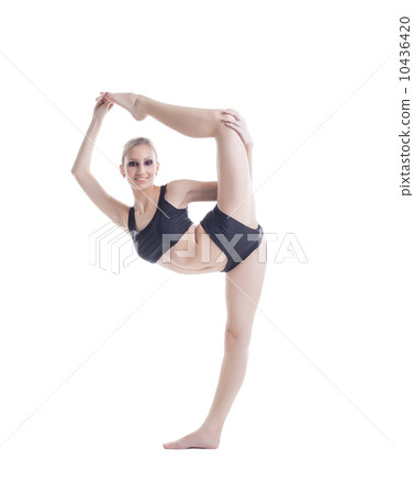 Flexible pretty blonde posing on vertical splits Flexible pretty blonde posing on vertical splits 10436420