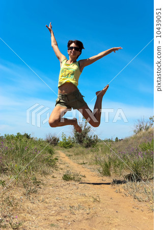 Beautiful girl jumping 10439051