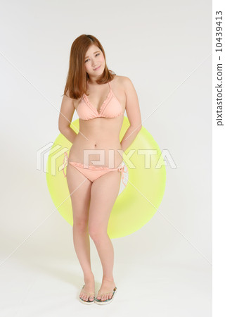 A swimwear young lady with floating rings 10439413