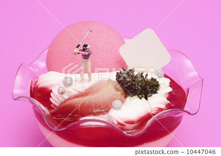 Miniature golfer on strawberry tiramisu 10447046