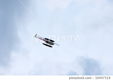 Helicopter flying in the blue sky 10447319